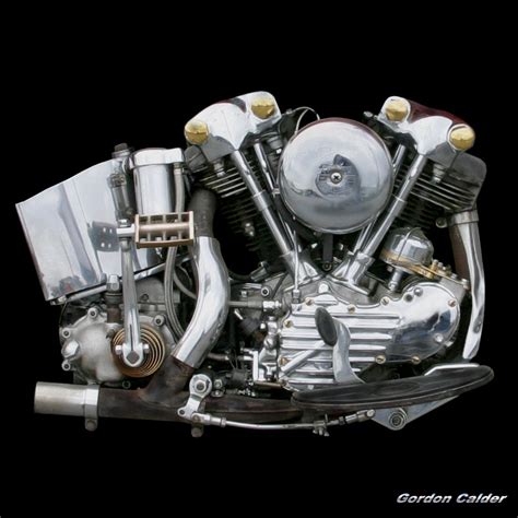 A Motorcycle Engine Is Shown On A Black Background