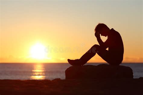 Sad Man Silhouette Worried On The Beach Stock Photo Image 51640055