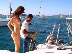 A Carefree And Naked Hanging Out On The Back Of The Boat In Bermuda