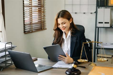 Beautiful Young Asian Lawyer Woman Sitting Working In The Office Stock