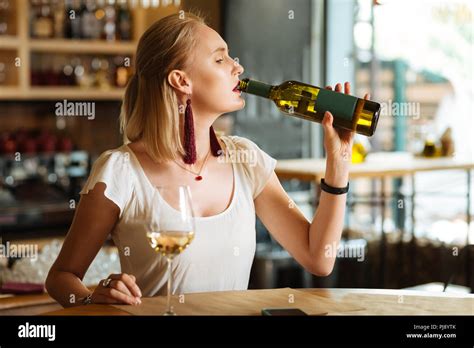 Nice Sad Woman Drinking Wine From The Bottle Stock Photo Alamy
