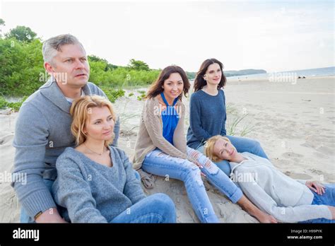 Group Of Friends On Beach Relaxing Stock Photo Alamy