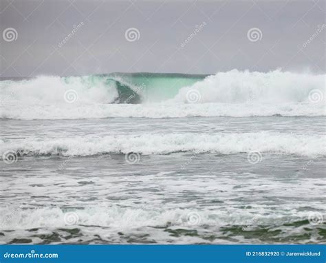 Beautiful Emerald Green Waves Of Pacific Ocean Hitting Shore Stock