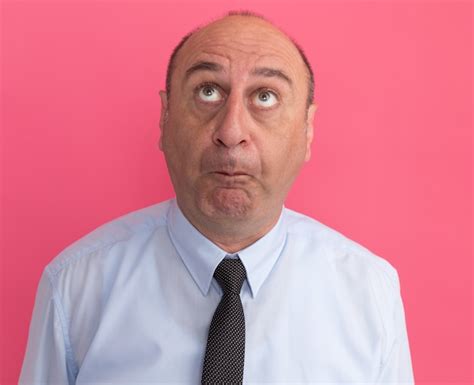 free photo unpleased looking up middle aged man wearing white t shirt with tie isolated on