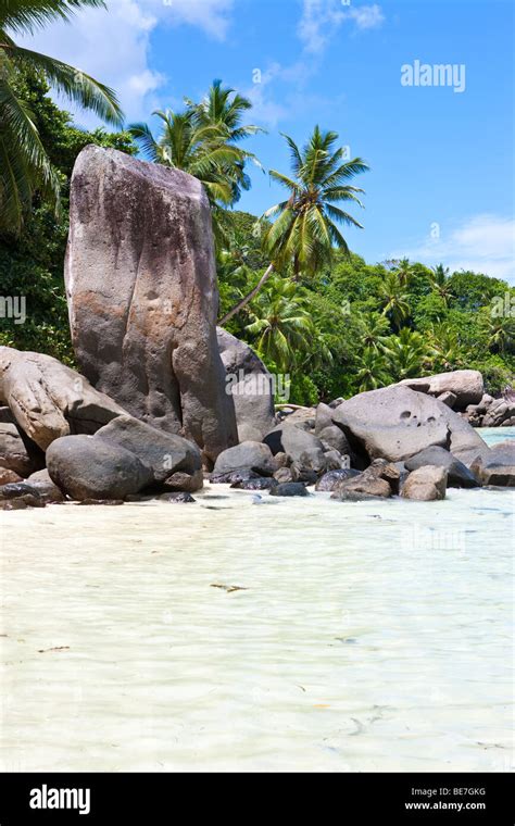 Beach With The Typical Granite Rocks Of The Seychelles At Anse Royale