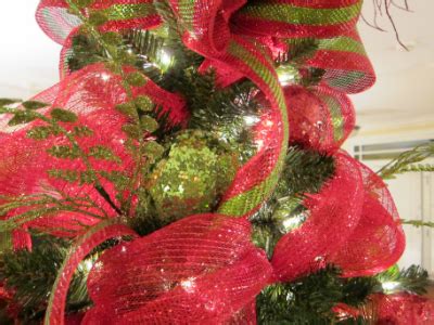 Miniature christmas trees are adorable to decorate if you have one main tree with all of your classic ornaments, then a smaller tree with a special theme. Deco Mesh Christmas Tree - Ladybug Wreaths by Nancy Alexander