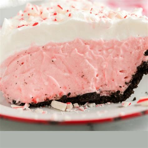 A Close Up Of A Piece Of Cake On A Plate With Candy Candy Cane Pie Holiday Desserts