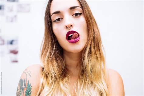 Portrait Of Woman Licking Her Lips By Stocksy Contributor Susana