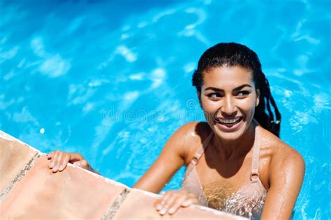 Beautiful Tanned Woman In Bikini Relaxing In Swimming Pool Stock Image