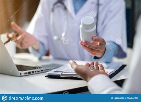 Doctor Therapist Consulting Male Patient About Pills Doctor