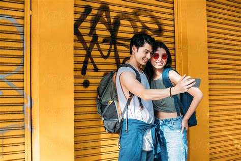 Young Asian Couple Taking A Selfie Del Colaborador De Stocksy Lumina Stocksy