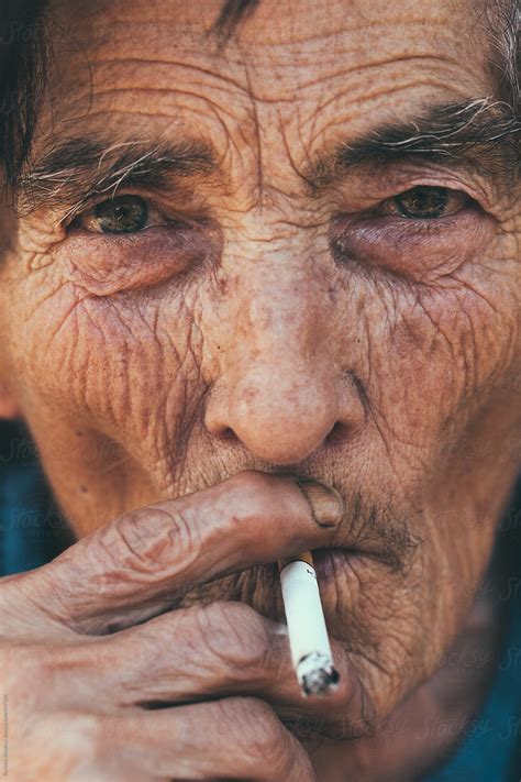 Old Woman Smoking Closeup By Stocksy Contributor Borislav Zhuykov