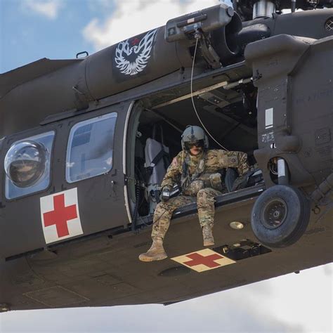 Usarmy Medic Observers From A Medevac Helicopter During A Training