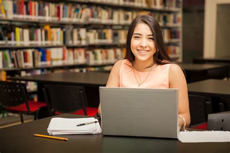 Pretty Girl Using A Laptop Computer Stock Photo Download Image Now
