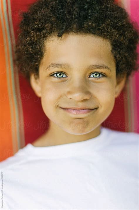 Portrait Of Handsome Hispanic Boy With Beautiful Green Eyes By