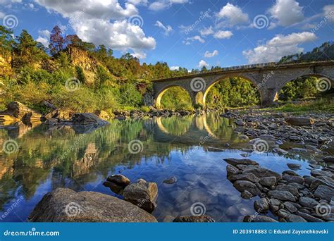 Amazing View Of The Peaceful River And Old Stone Bridge Stock Image