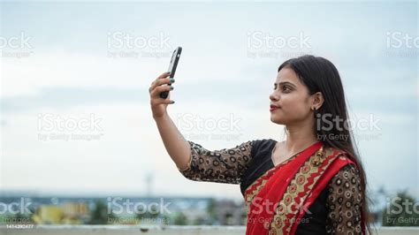 Beautiful Indian Girl Taking Selfie On Her Mobile Phone Outdoor