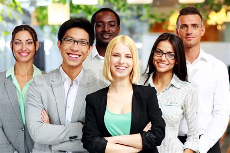 Happy Group Of Co Workers Standing In Office Stock Image Colourbox
