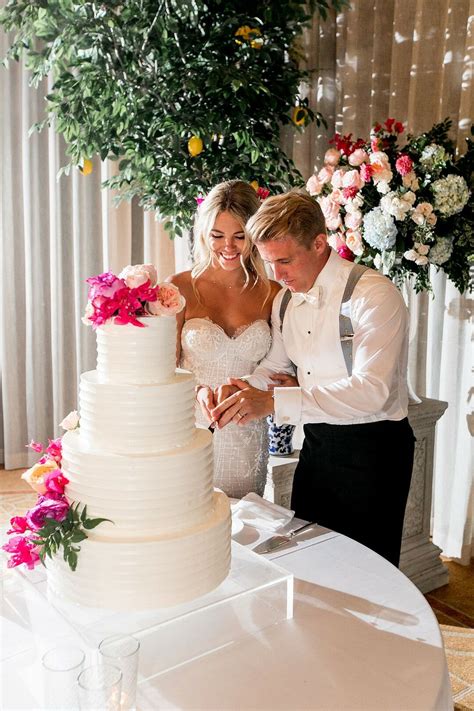 glamorous cake cutting with bride and groom