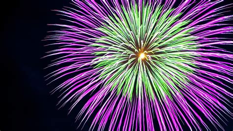 Download Wallpaper 1366x768 Fireworks Sparks Lights Holiday Purple