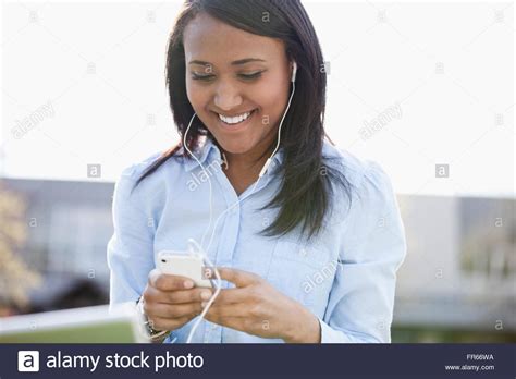 Pretty College Student Listening To Music Stock Photo Alamy