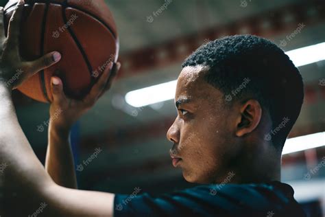 Premium Photo African American Teenage Boy Concentrated On Playing