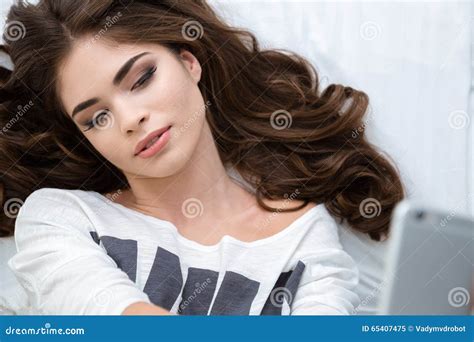 Top View Of Beautiful Lying Woman Taking Selfie With Smartphone Stock Image Image Of Life