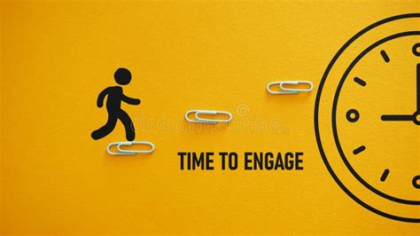 Time To Engage Is Shown Using The Text And Picture Of Clock Stock Image