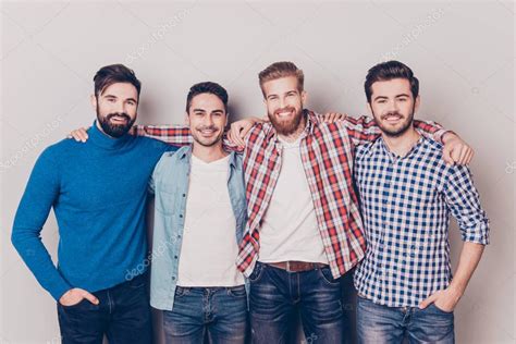 Diversity Of Men Four Cheerful Young Guys Are Standing And Embr