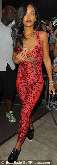 rihanna looks purrrfect as she shows off her figure in lycra leopard print catsuit albeit just