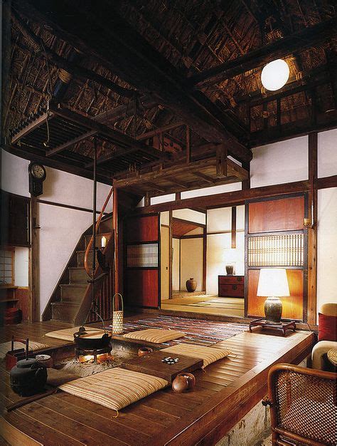 Interior Of Japanese Country House With Central Fire Pit And Thatched