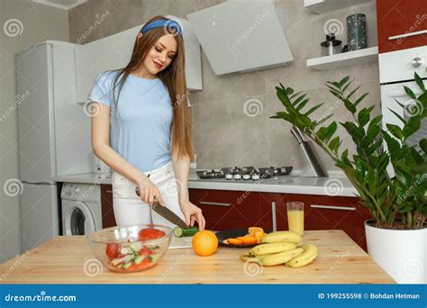 Beautiful Girl In A Kitchen With A Vegetables Stock Photo Image Of