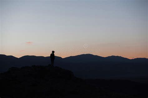 Man Silhouette Stay On Sharp Rock Peak Satisfy Hiker Enjoy View Tall