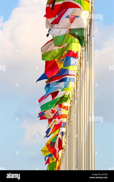 Different Countries Flags On Flagpoles On The Sky Background Stock