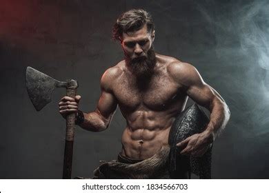 Стоковая фотография 1834566703 Serious Muscular Viking Beard Naked