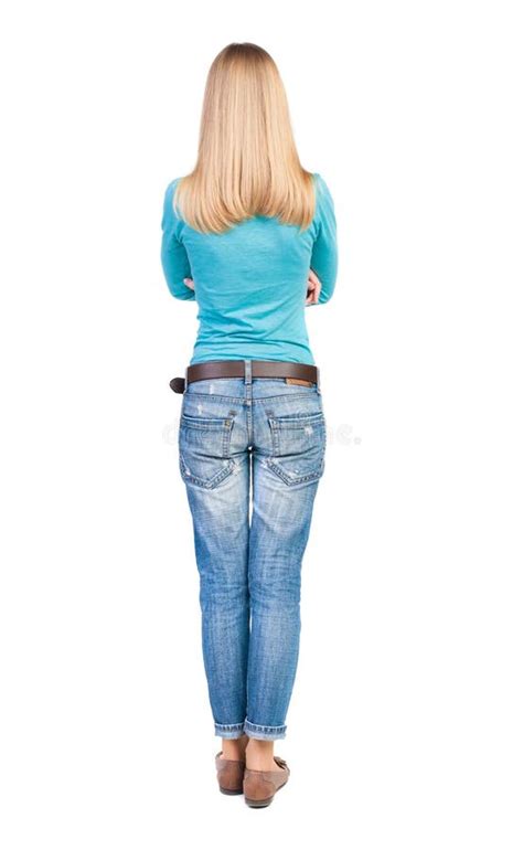 Back View Of Standing Young Beautiful Woman In Jeans Stock Photo