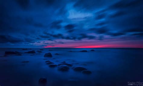 Blue And Red Long Exposure Photo Of Sunset In Beach