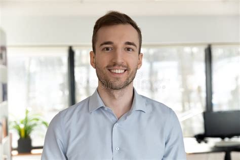 Profile Picture Of Caucasian Male Employee Posing In Office Stock Image