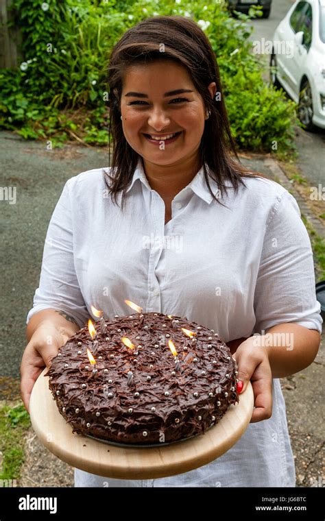 Woman Presenting Birthday Cake Hi Res Stock Photography And Images Alamy