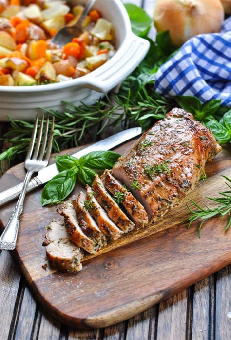 Rub a tenderloin with mustard powder and thyme, and pour sherry, soy sauce, garlic and ginger over the top. One Dish Garlic and Herb Pork Tenderloin - The Seasoned Mom