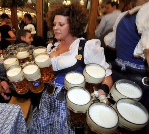 Waitress Helga Carries Beer Glasses In The Hofbraeuhaus Beer Tent At The Theresienwiese