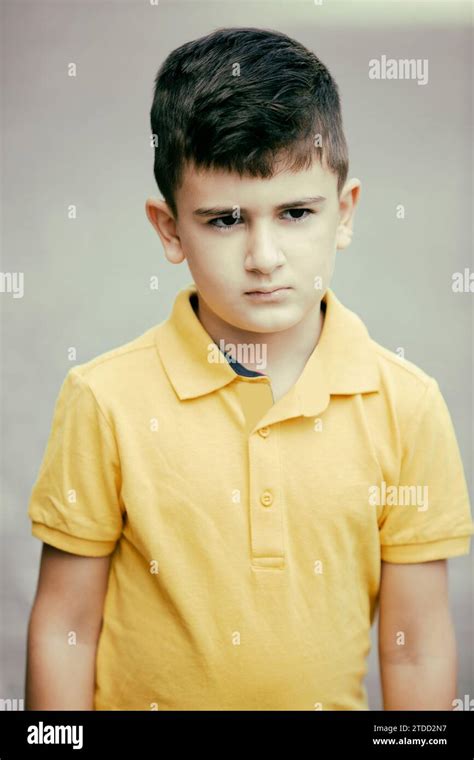 8 Years Old Boy Standing Outdoors Looking Away Stock Photo Alamy