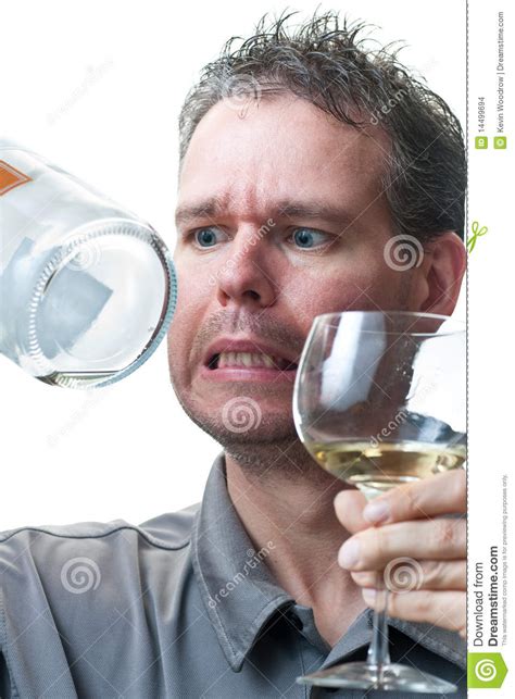 Hold all stemmed wine glasses (red, white, etc) towards the base of the stem between your thumb, forefinger and middle finger. Man Holding Wine Glass And Empty Bottle Stock Images - Image: 14499694