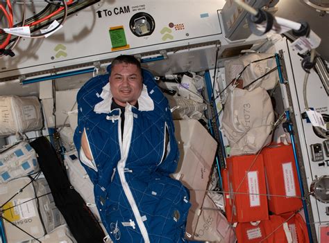 Astronaut Kjell Lindgren Poses For A Portrait Inside A Crew Sleeping