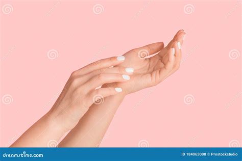 Young Woman Showing Hands With Silky Skin And Perfect Manicure On Pink