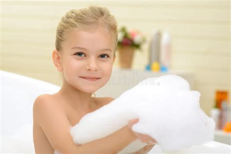Pleasant Little Girl Playing In Bath Tube Stock Image