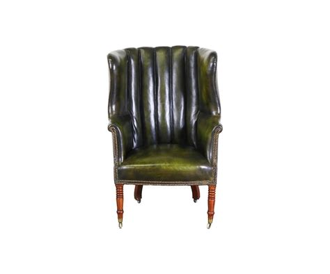 Treated hides are easy to clean and will withstand use for years on end. Vintage Green Leather High Back Wing Chair at 1stdibs