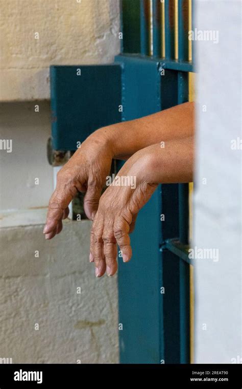 Hands Hanging Out Through Prison Bars Stock Photo Alamy