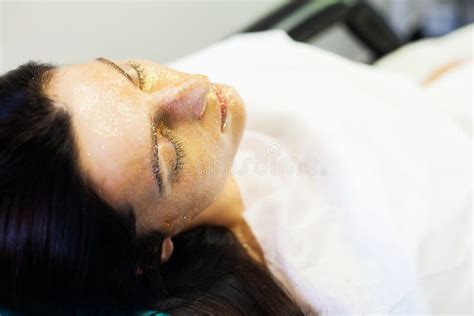 Spa Therapy For Young Woman Having Facial Mask At Beauty Salon Stock