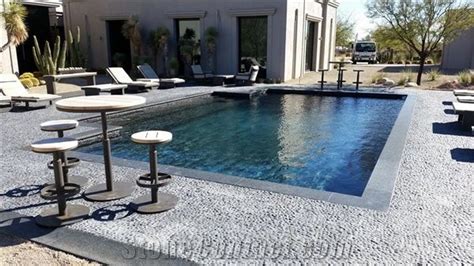 Blue Stone Coping And Black Pebble Tile Swimming Pool
